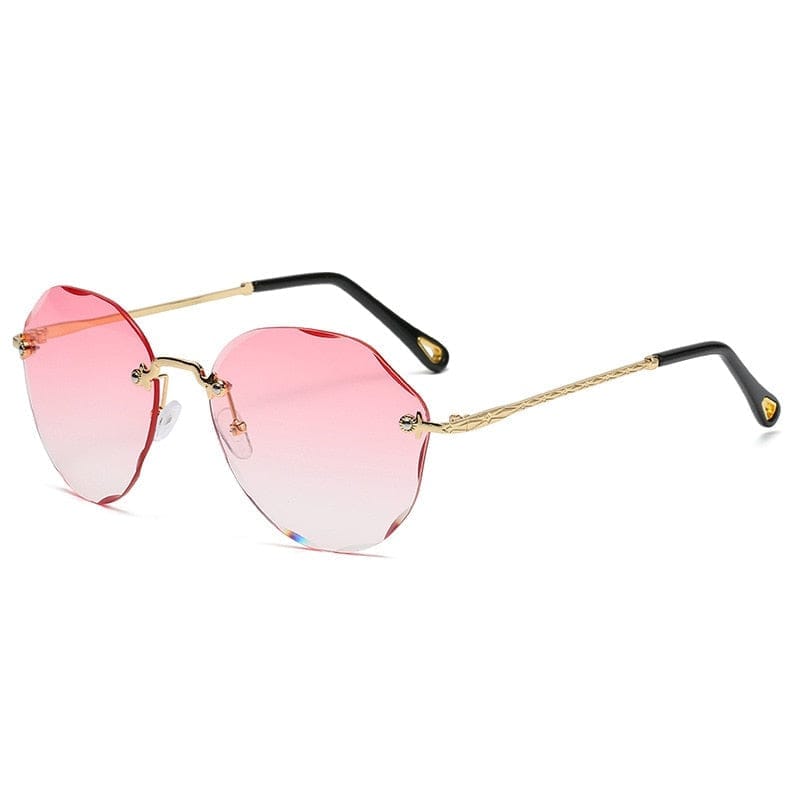 https://bennysbeautyworld.ca/cdn/shop/files/Classic-Rimless-Round-Sunglasses-For-Women-Sexy-Gradient-Oversized-Sun-Glasses-Bennys-Beauty-World-1385.jpg?v=1702390271&width=800