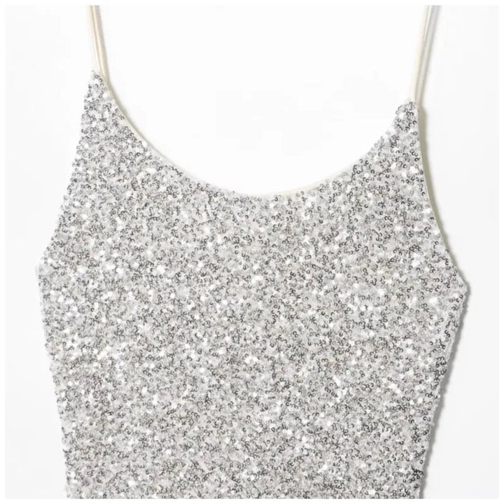 Silver glittery crop top on a white background